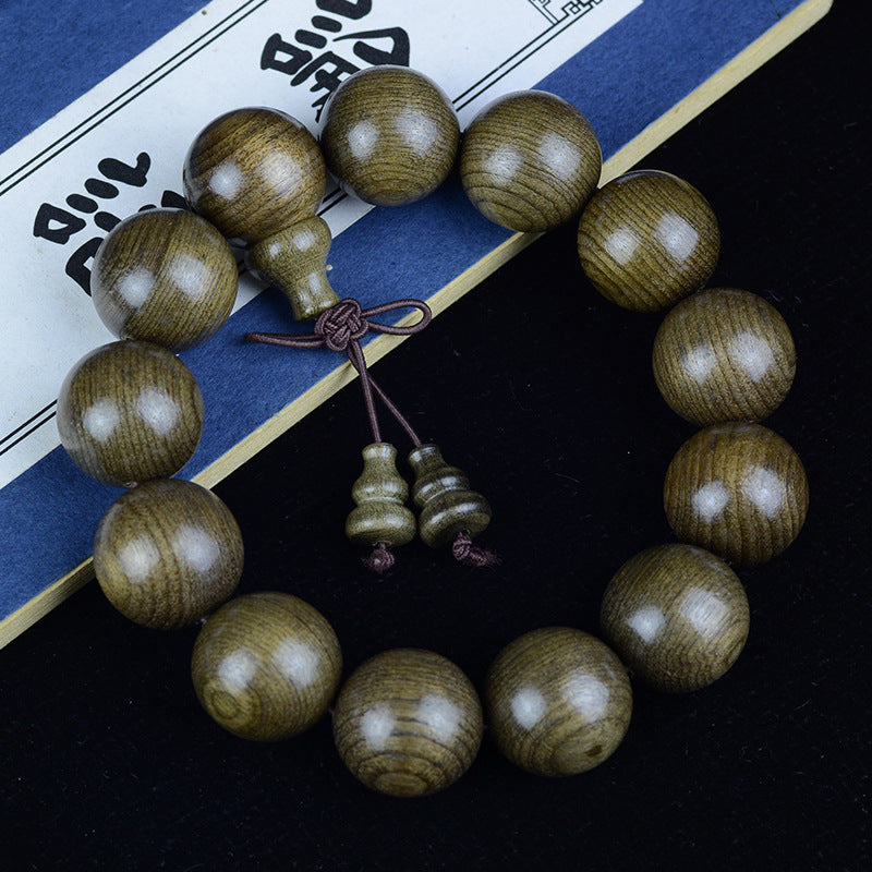 Yinchen wood gourd-accent bracelet styled for a Chinese scholar desk