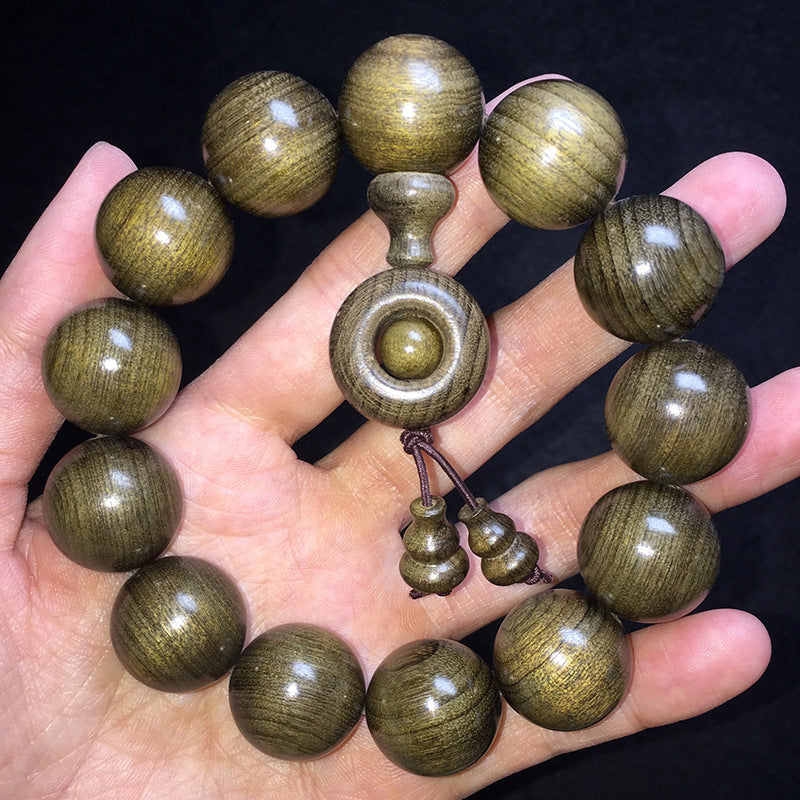 Large-bead Yinchen wood bracelet with turning-wheel centerpiece and gourd accents