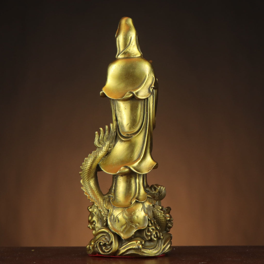 Rear view of Yulong Guanyin copperware statue showing flowing robes, coiling dragon and cloud base details