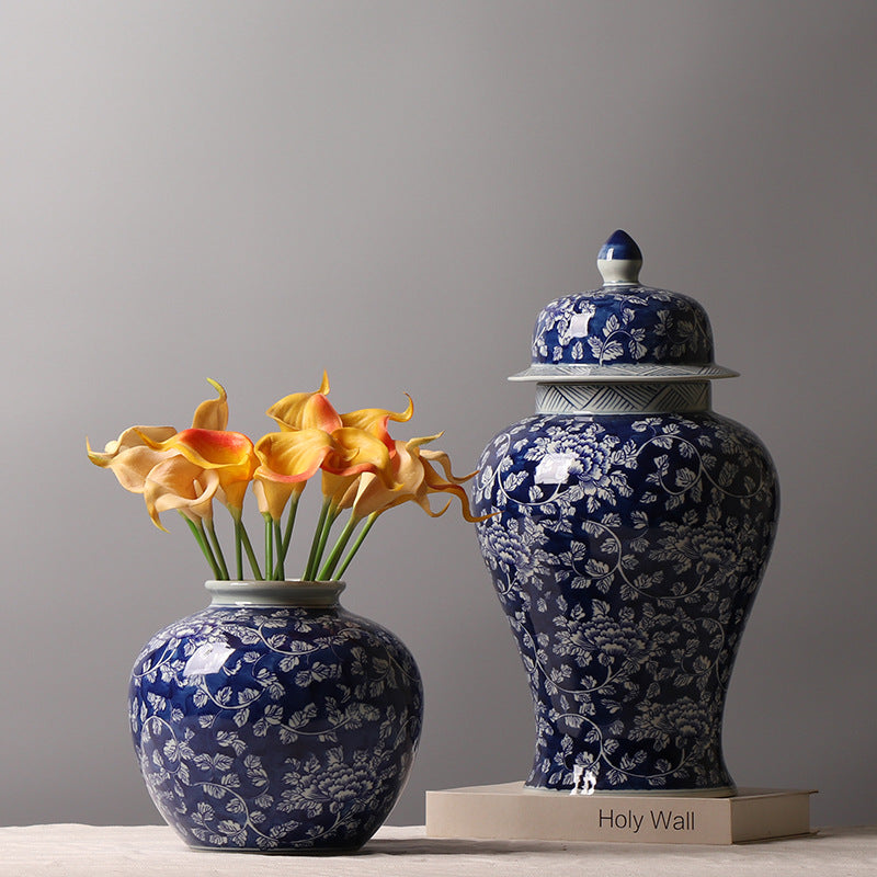 Cobalt blue floral ginger jars styled with orange flowers