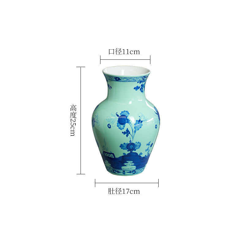 Celadon green and cobalt floral ceramic vase, 17 cm wide and 25 cm high