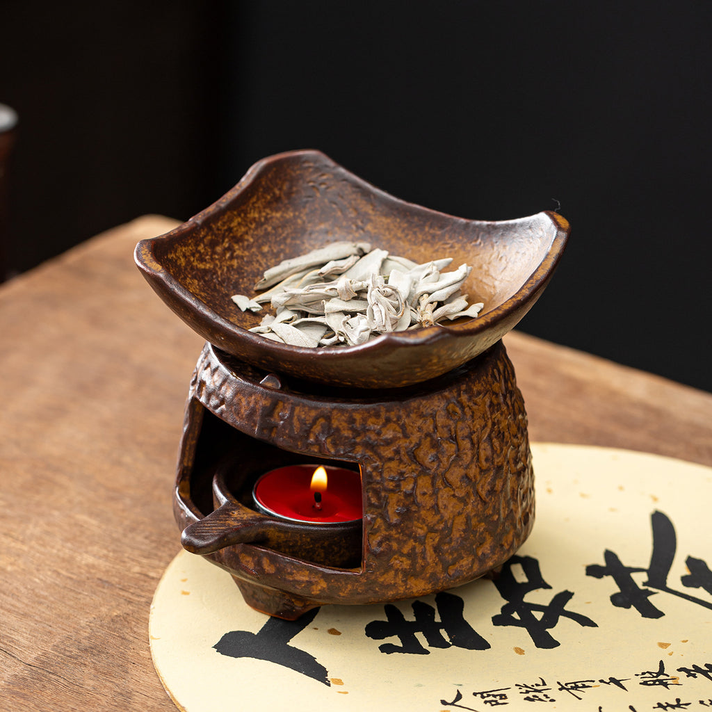 Curved tile ceramic tea roaster warming dried tea leaves over tealight