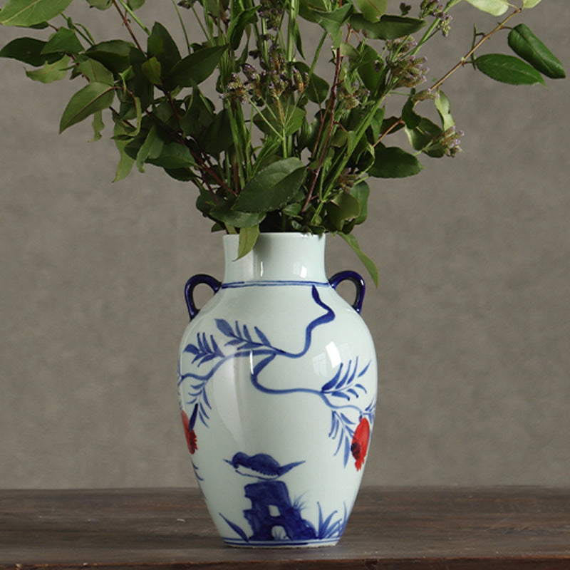 Blue and white double-ear pomegranate vase styled with fresh greenery