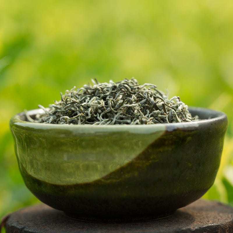 Close-up of curled Bi Luo Chun green tea leaves