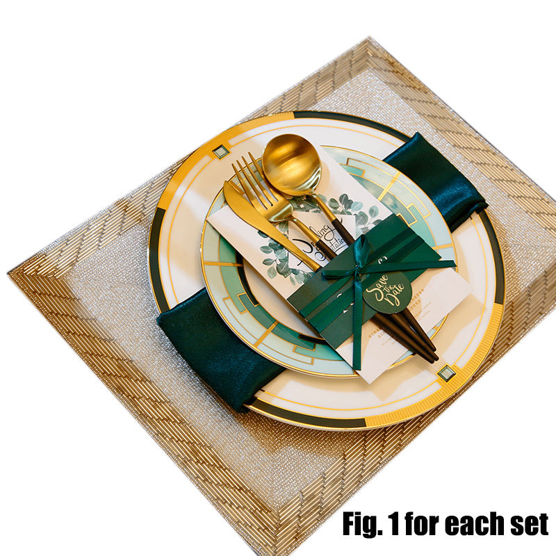 Complete emerald green, ivory and gold geometric table setting with plates, flatware and square placemat
