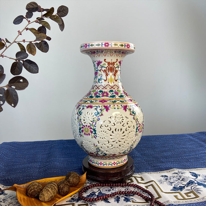 Famille rose openwork porcelain vase styled with dark botanical branch
