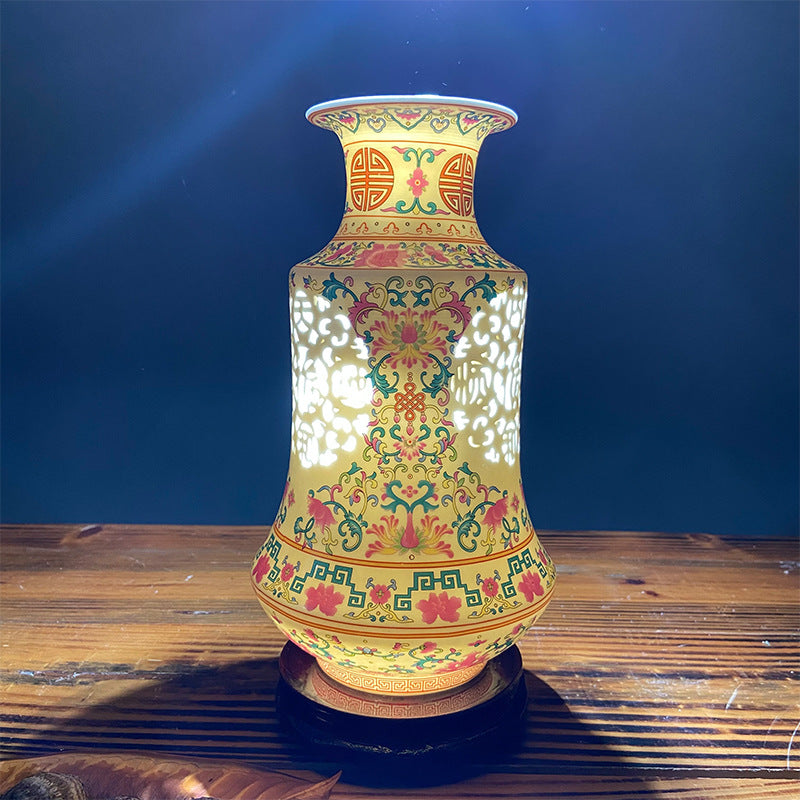 Famille rose reticulated Chinese porcelain vase on dark blue background