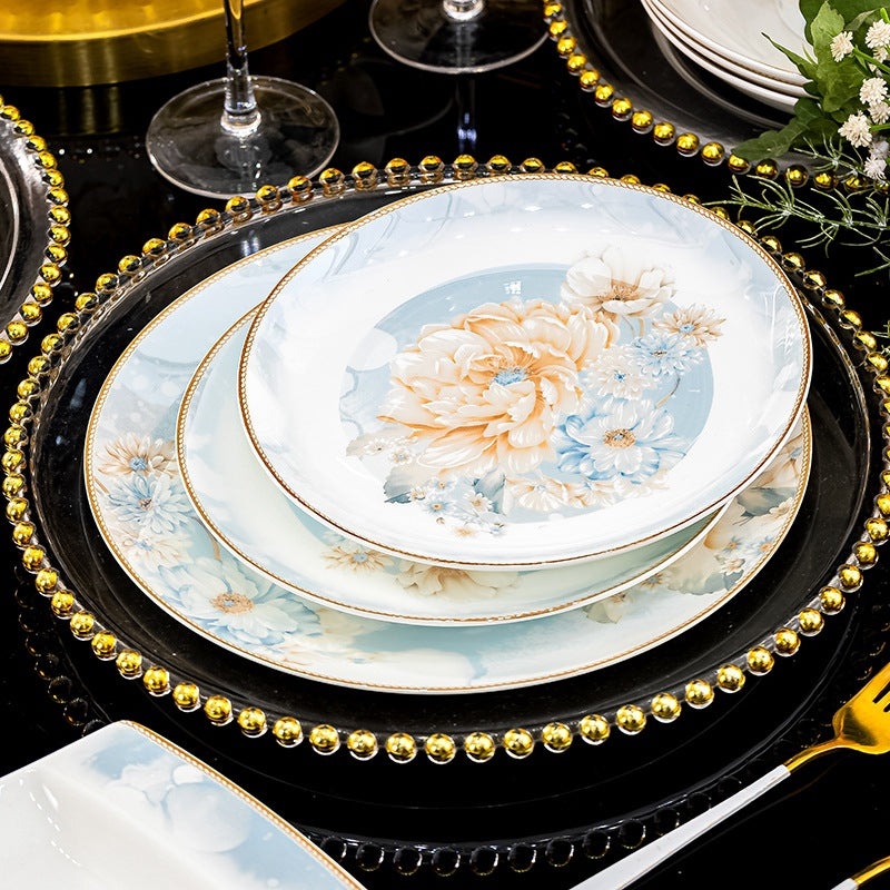 Fan Hua Ying Xue pale blue, ivory and gold floral dinnerware layered on a luxury table setting