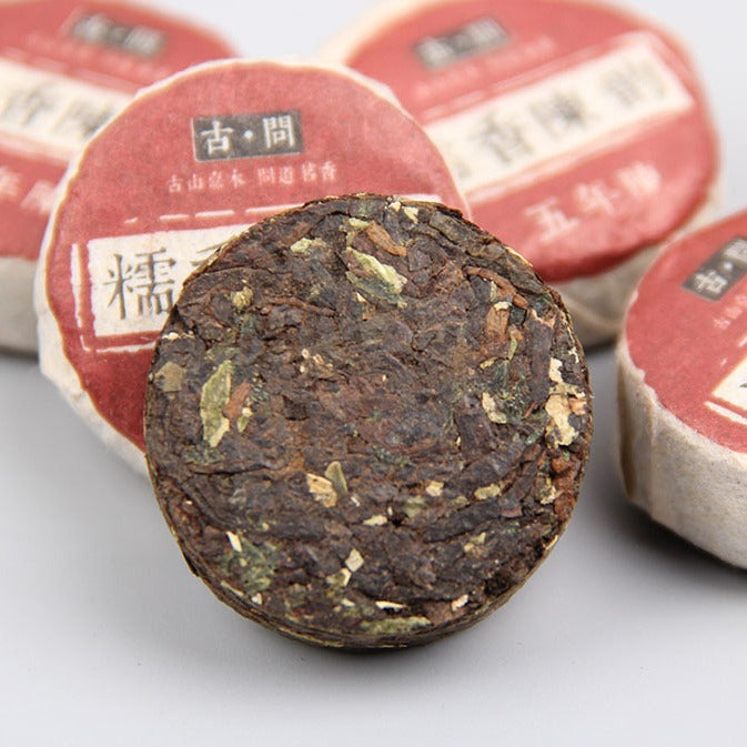 Five-Year Aged Sticky Rice Aroma ripe Pu-erh mini cake unwrapped leaf detail