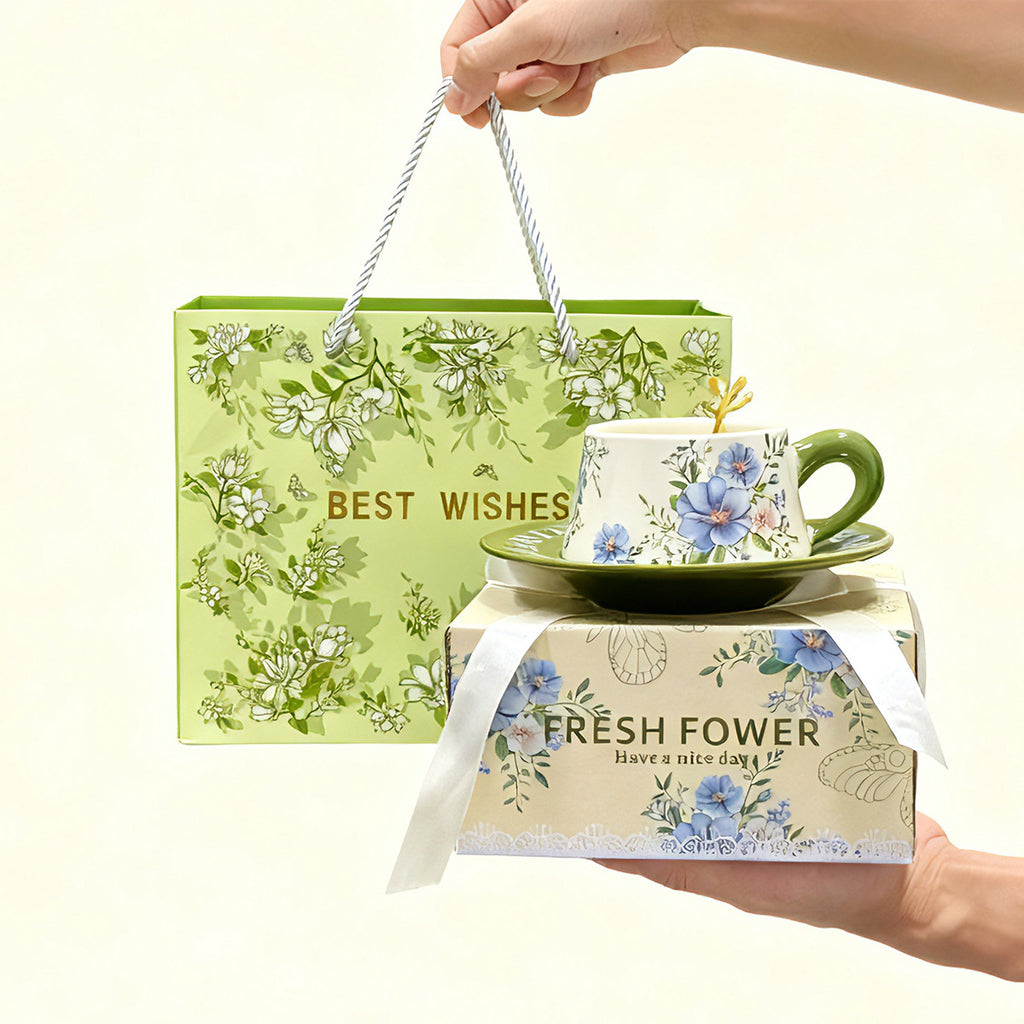 Painterly botanical ceramic cup and saucer with pink floral design and presentation gift packaging