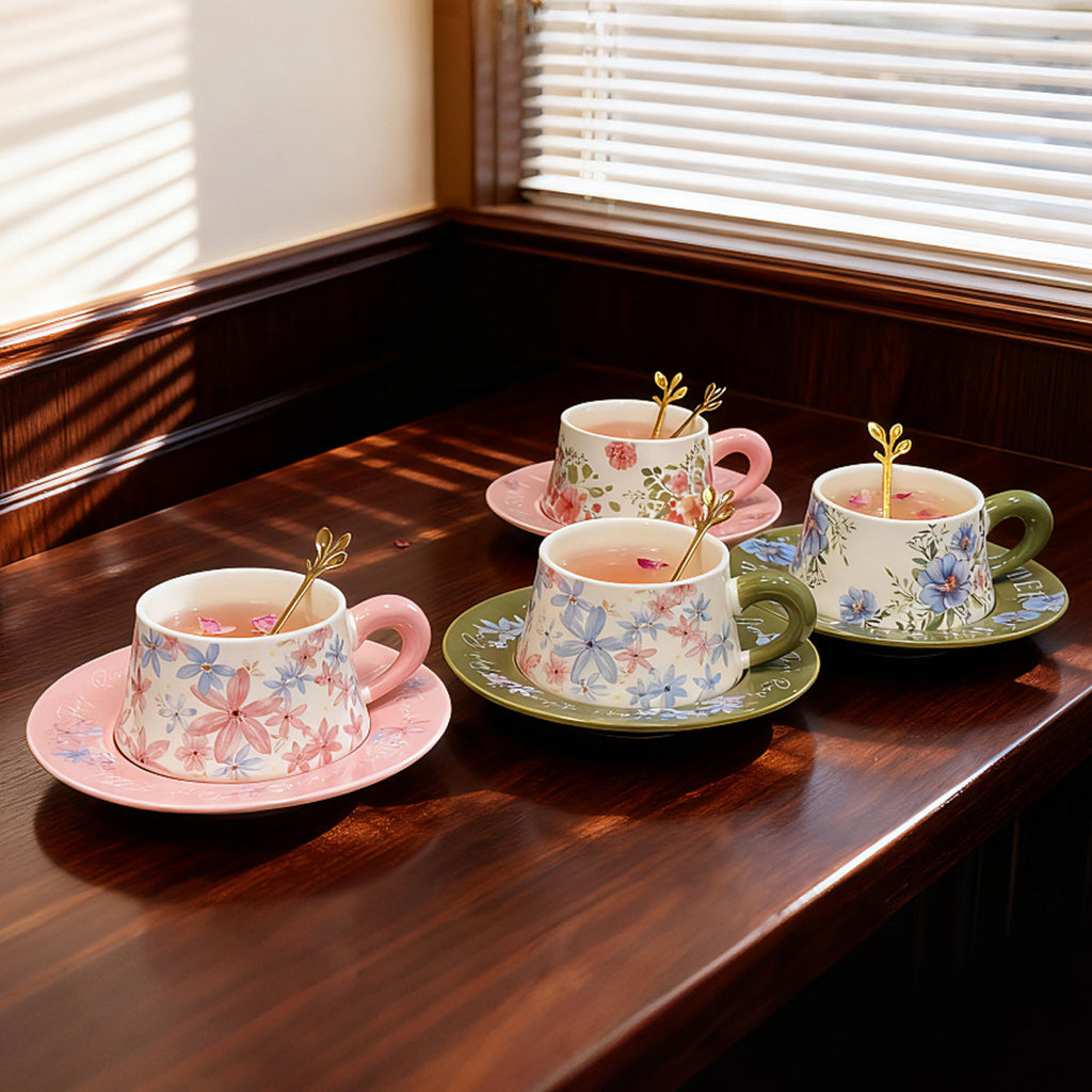 Pink and green botanical ceramic coffee cups with matching saucers and floral gift-box styling