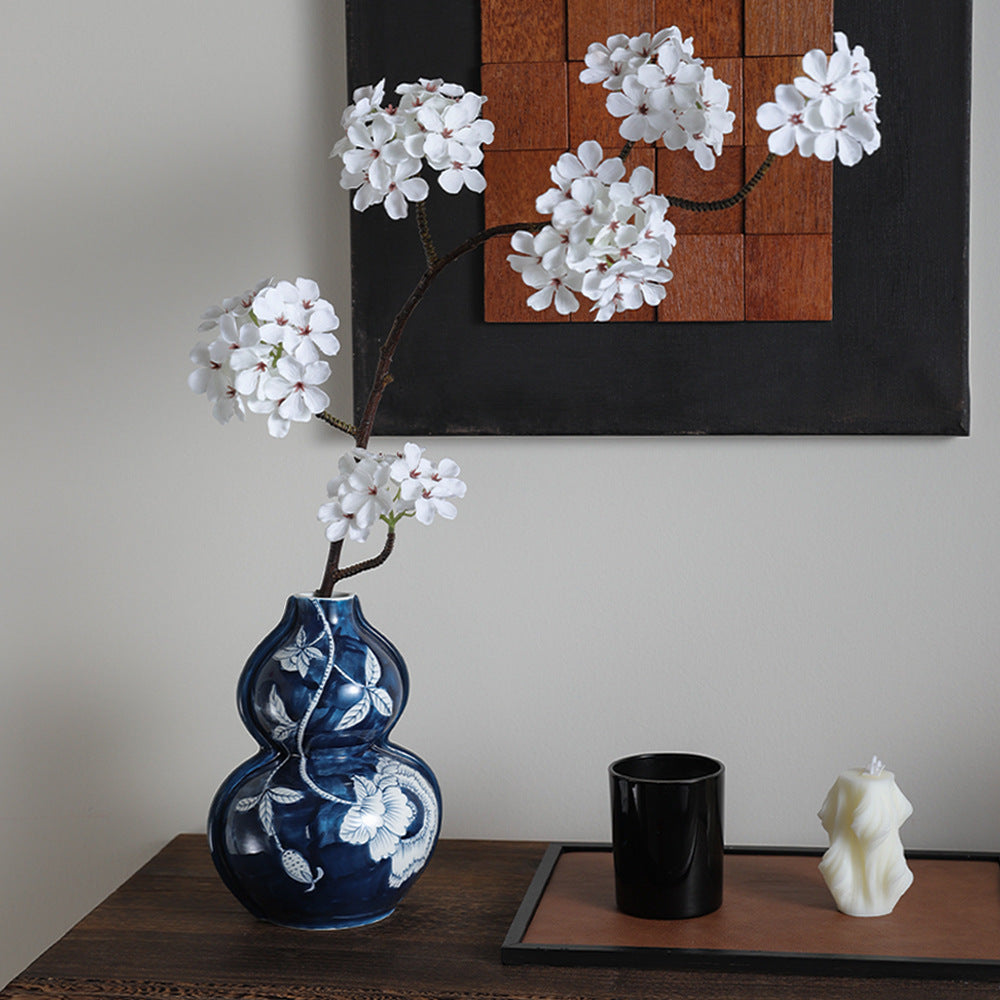 Blue fortune floral gourd vase styled with white flowering branches