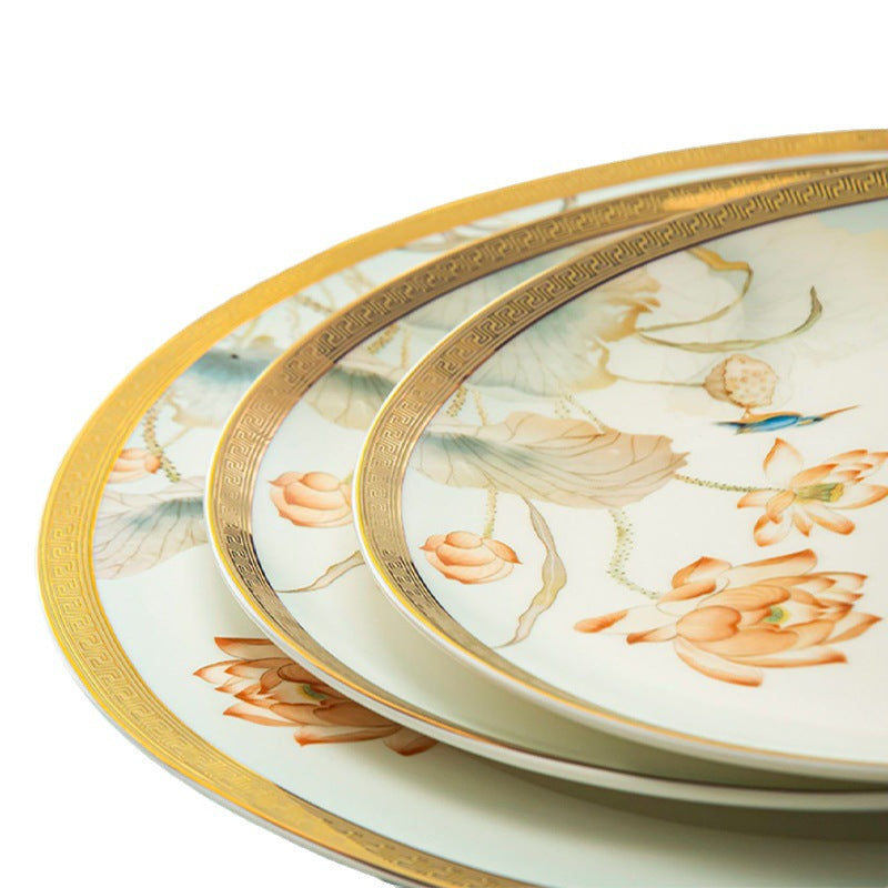Close-up of Furong Xuan floral bone china plates showing gold rim detail