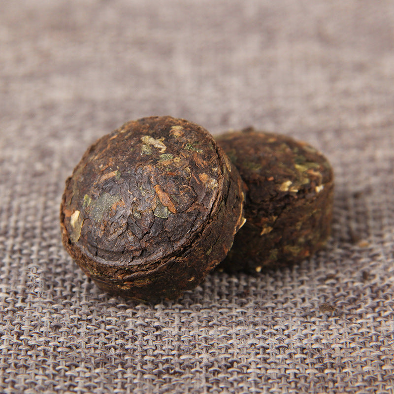 Unwrapped glutinous rice aroma ripe Pu-erh mini tuocha close-up