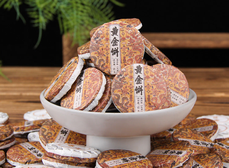 Golden Leaf raw Pu-erh mini cakes showing compact 6g tea portions