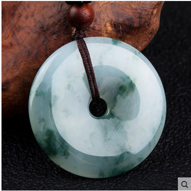Natural jadeite peace buckle pendant, translucent pale green round carving close-up