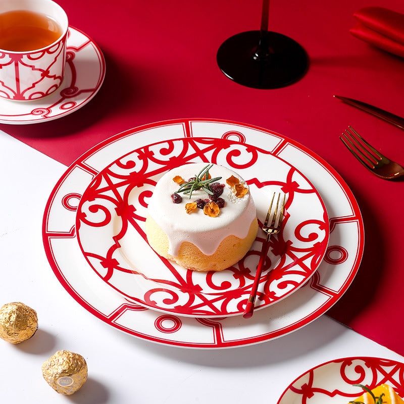 Grande red and white geometric tableware with layered dinner plates, dessert plate and cup