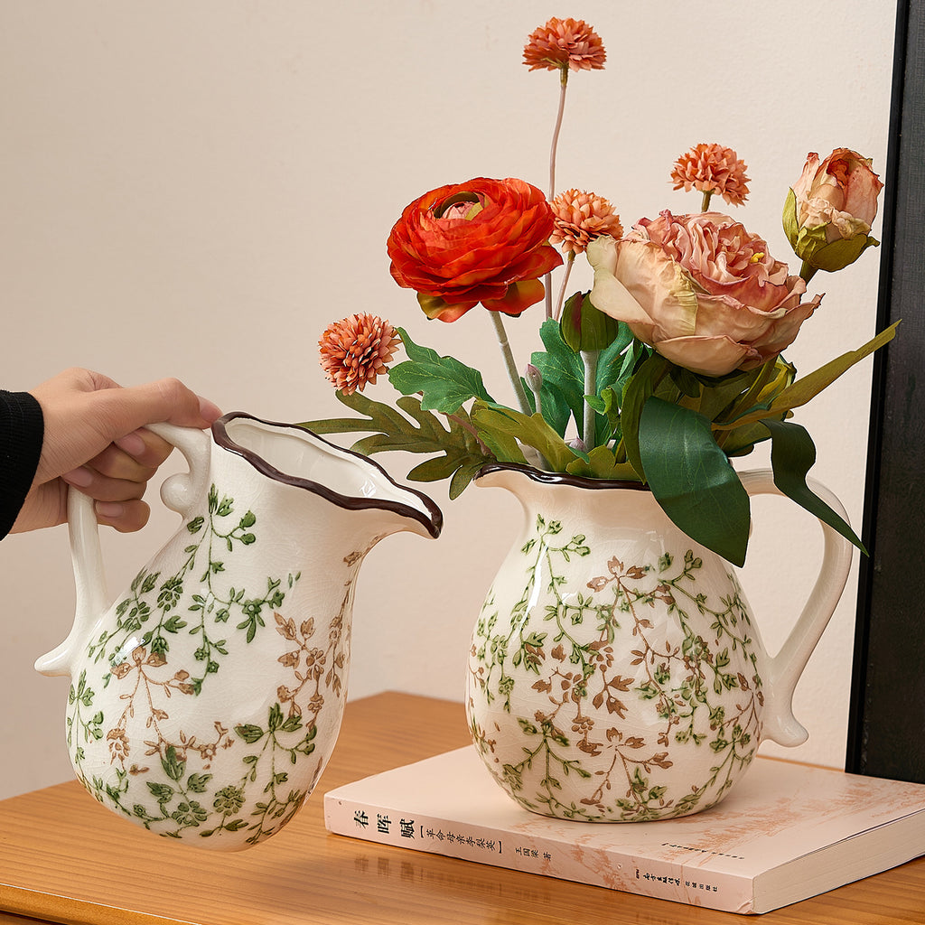 Green branch ceramic pitcher vases in tall and round forms styled with flowers