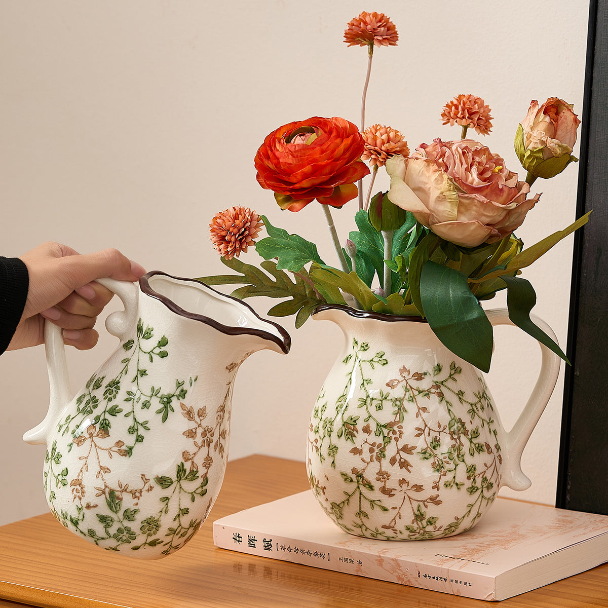 Green branch ceramic pitcher vases in tall and round forms styled with flowers