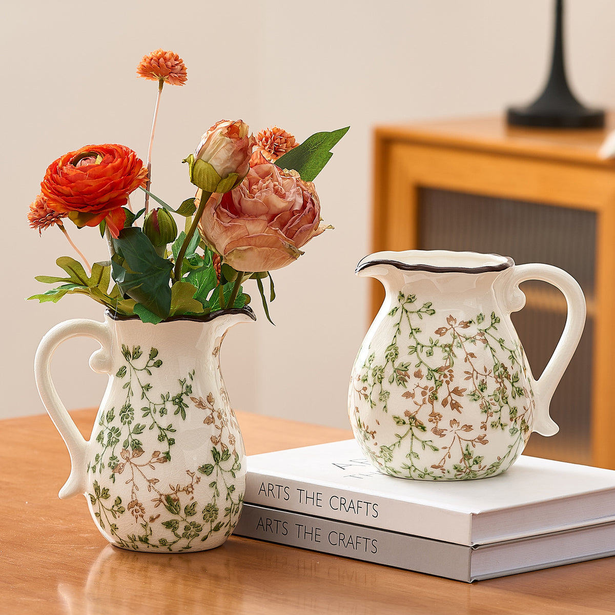 Green branch ceramic pitcher vase styled with fresh flowers