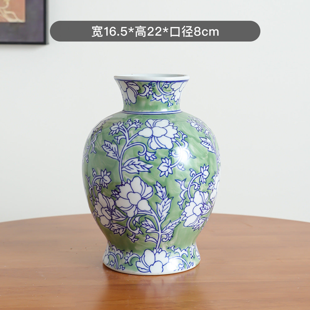 Green floral baluster ceramic vase, 16.5 cm wide and 22 cm high