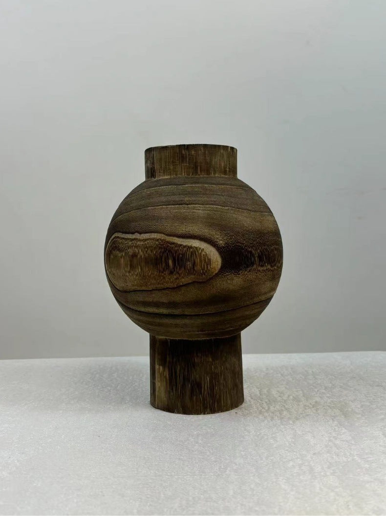 Natural solid wood pedestal orb vase with visible grain