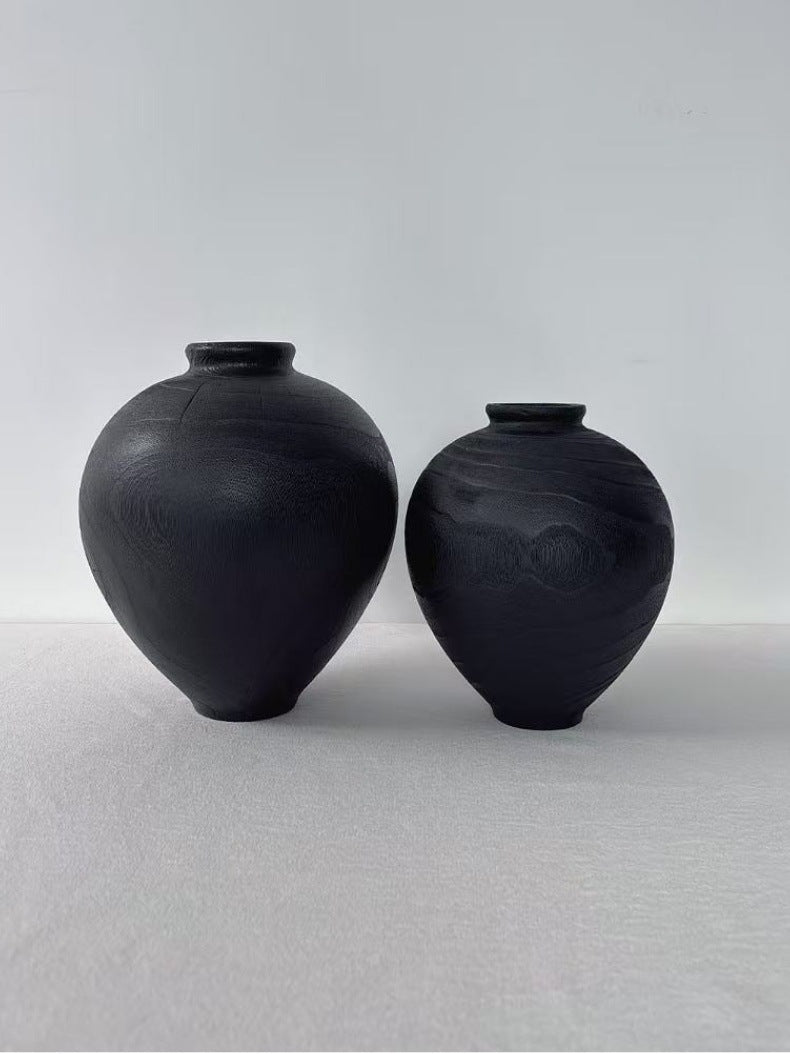 Black hand-carved wood rounded belly vase pair