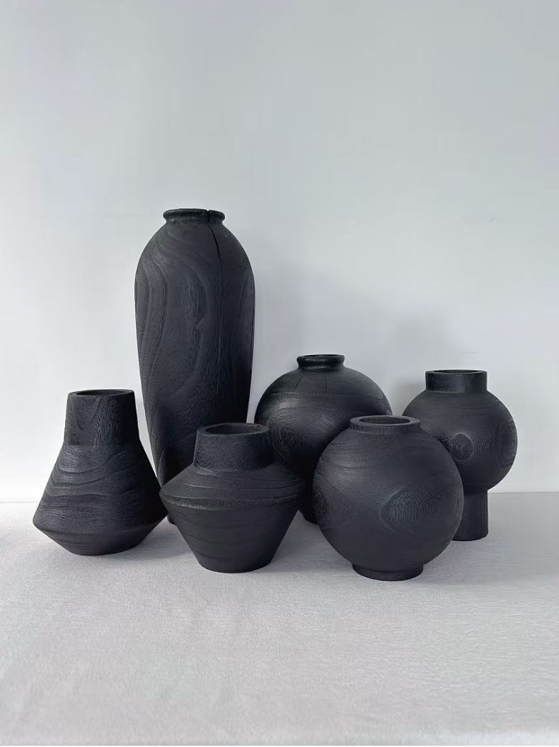 Black hand-carved solid wood vase collection in varied wabi-sabi forms