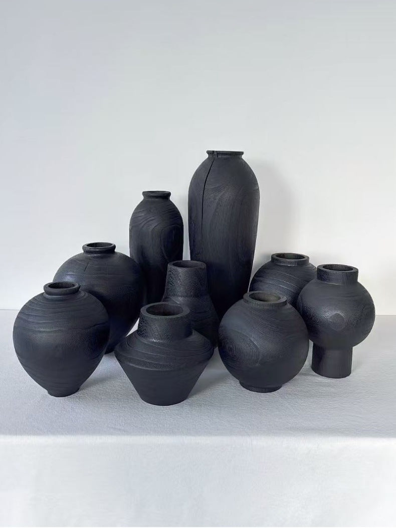 Black solid wood decorative vase set in ten sculptural forms