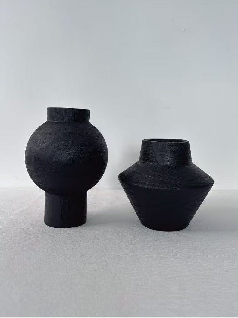 Black hand-carved solid wood vases in orb and low sculptural forms