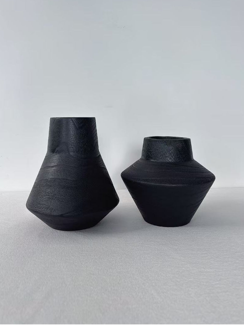 Black hand-carved solid wood sculptural vase pair with angular forms