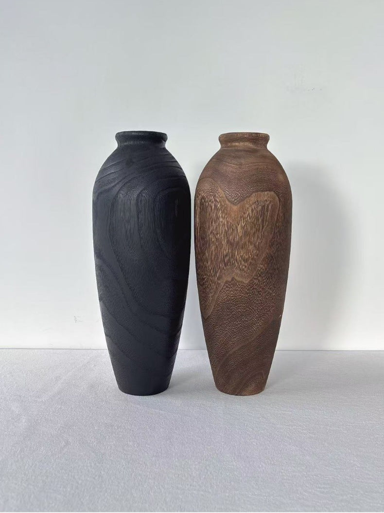 Tall hand-carved solid wood vases in natural carbonized and black finishes
