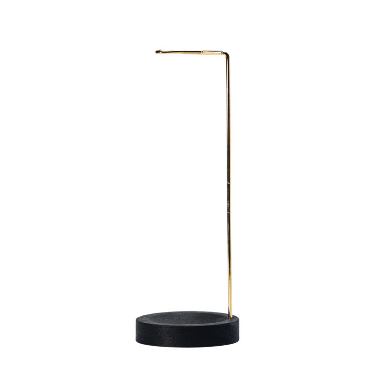 Black wood base and gold arm hanging incense holder on white background