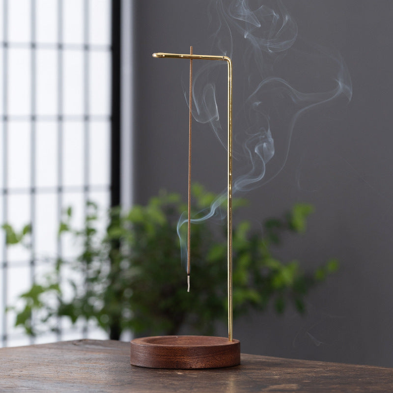 Minimalist hanging incense stick stand with walnut wood base and gold metal arm