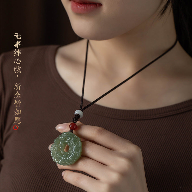 Lake green Hetian jade dragon Ping An Kou pendant carved detail