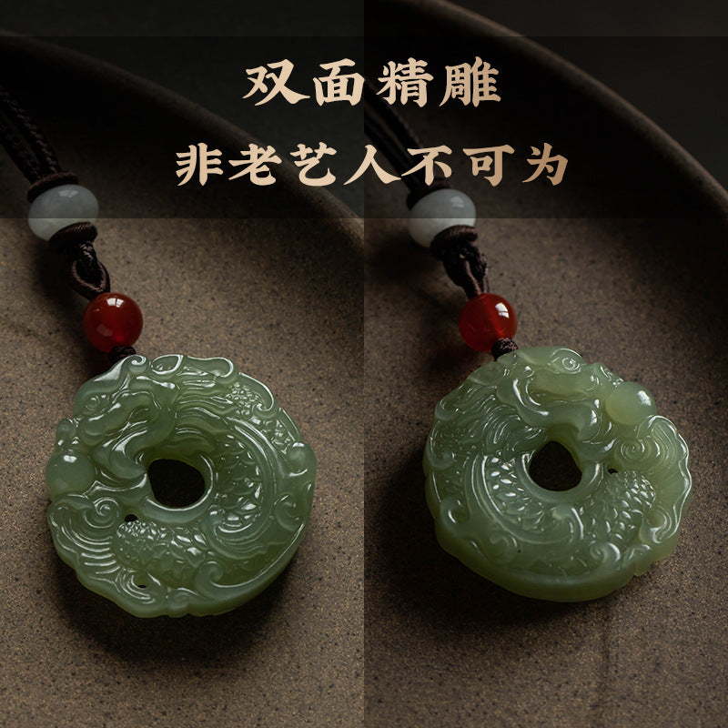 Carved Chinese dragon motif on certified natural Hetian jade peace buckle