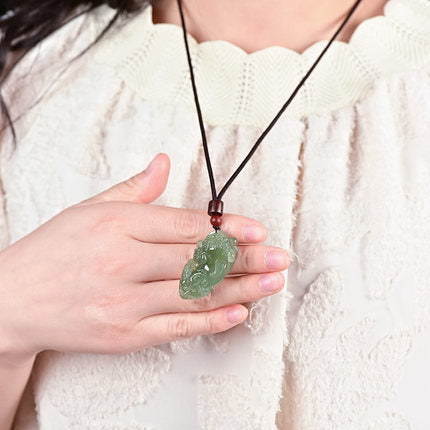 Natural Hetian jade Pixiu amulet necklace carved craftsmanship close-up