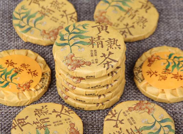 Stacked individually wrapped Huangjing ripe Pu-erh mini tea cakes