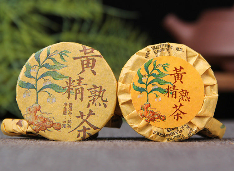 Two individually wrapped Huangjing ripe Pu-erh mini tea cakes