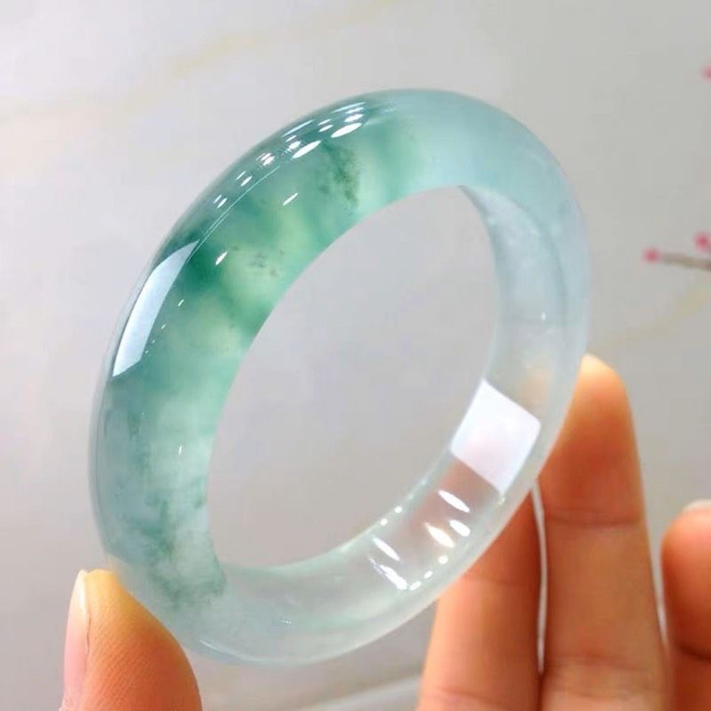 Natural quartzite jade bangle with pale green and blue-green floating inclusions