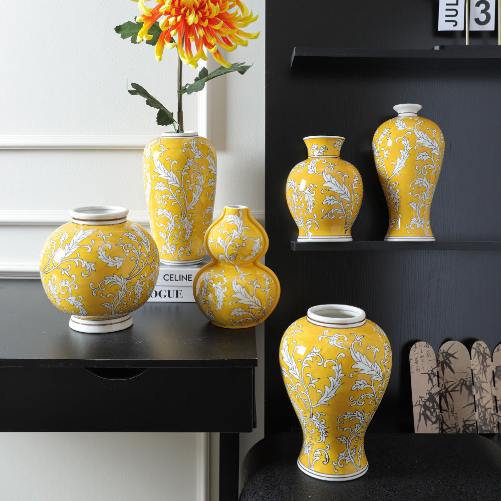 Imperial yellow Chinese ceramic vase collection styled on black shelving