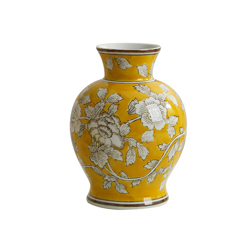 Imperial yellow and silver peony ceramic vase styled on a neutral background