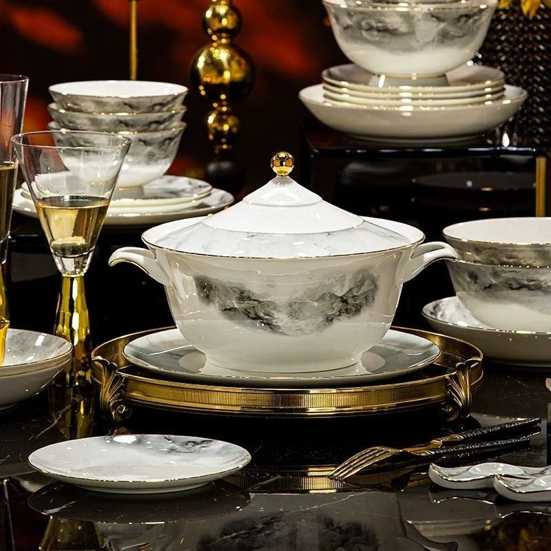 Ink-wash landscape bone china tureen and bowls styled on a formal black and gold dining table