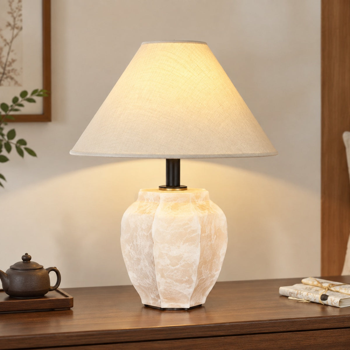 Ivory sculptural ceramic table lamp with irregular faceted jar body and linen shade