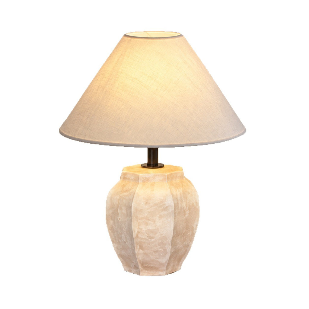 Ivory ceramic jar table lamp with warm tapered shade, isolated product view