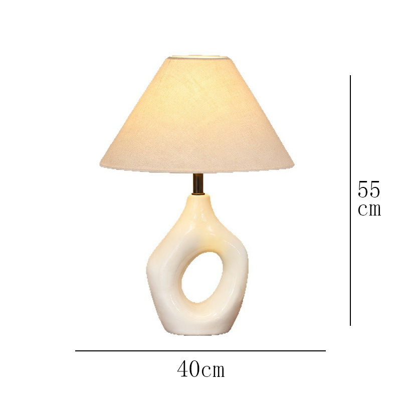 Ivory hollow ring ceramic table lamp, approximately 40 cm wide and 55 cm high