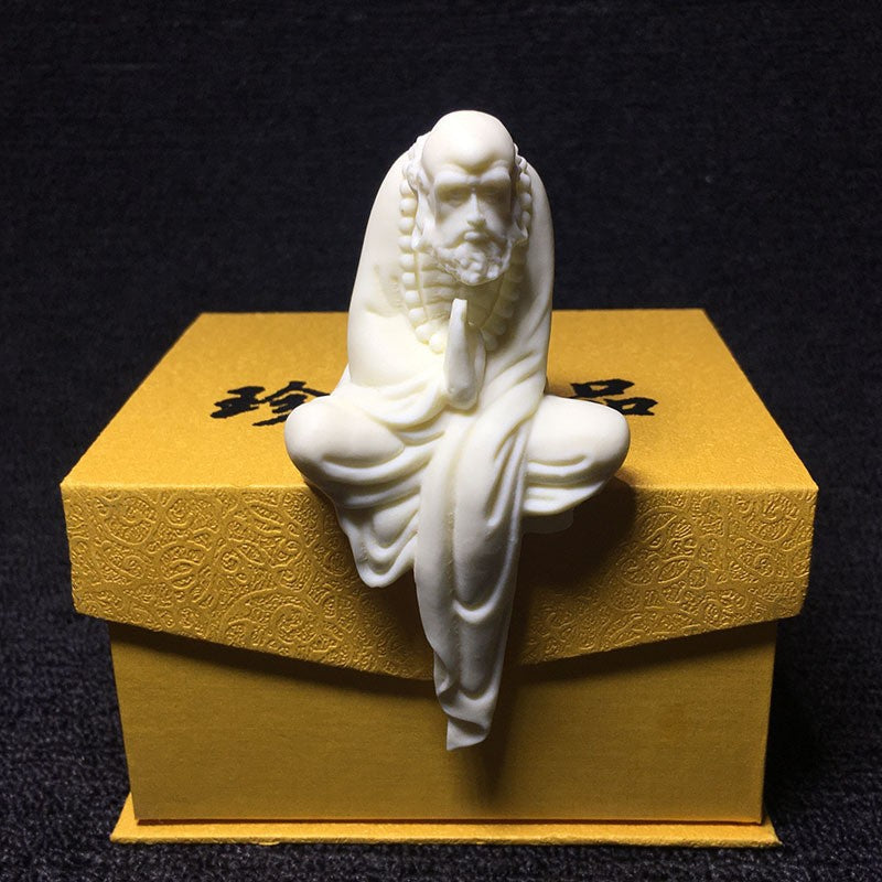 Ivory nut Bodhidharma seated figure displayed on gift box, Chinese Zen home and desk decor