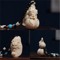 Ivory nut Chinese dragon carving collection showing Dragon-Head Gourd, Soaring Dragon and Ten Thousand Blessings styles, tagua vegetable ivory handpieces