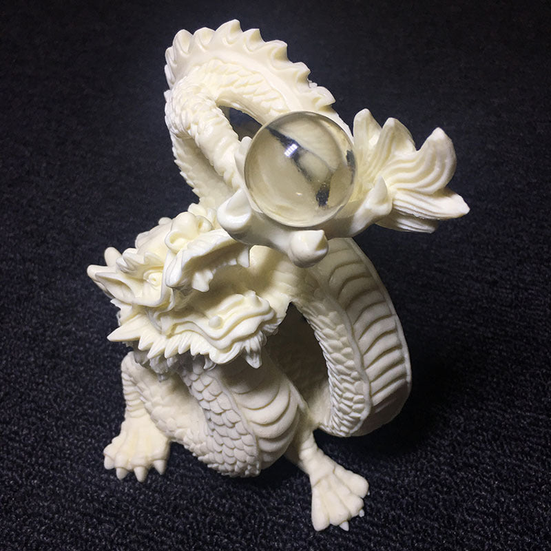 Carved ivory nut tagua dragon ornament with pearl motif for Chinese feng shui desk and shelf decor