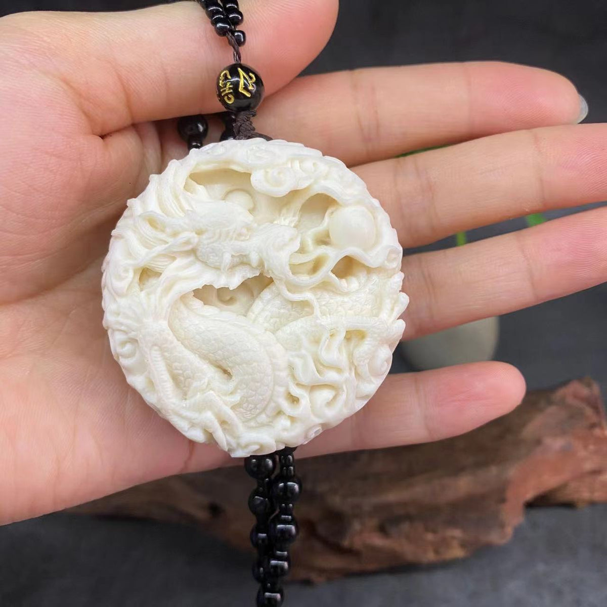 Ivory nut Dragon and Phoenix Long Feng Cheng Xiang round pendant, dragon-side tagua vegetable ivory Chinese auspicious carving with bead cord